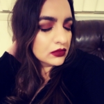Warm eyes, bold red lips