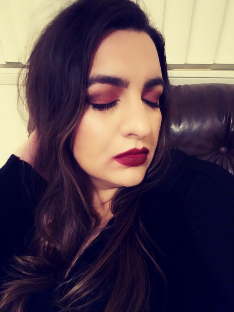 Warm eyes, bold red lips